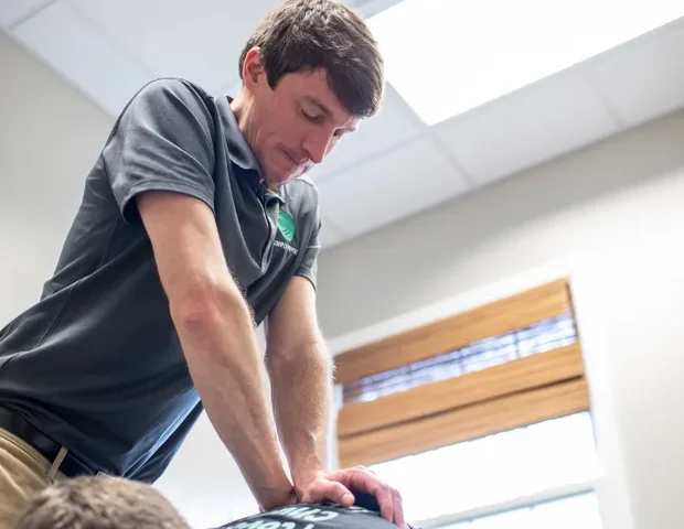 Doctor of Physical Therapy reviewing a treatment plan with a patient