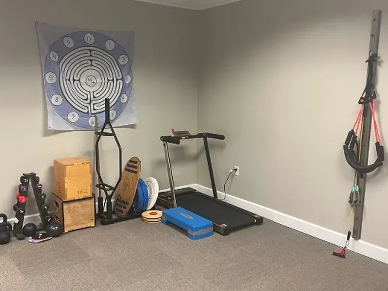 Doctor of Physical Therapy assessing joint stability for a patient with hypermobility